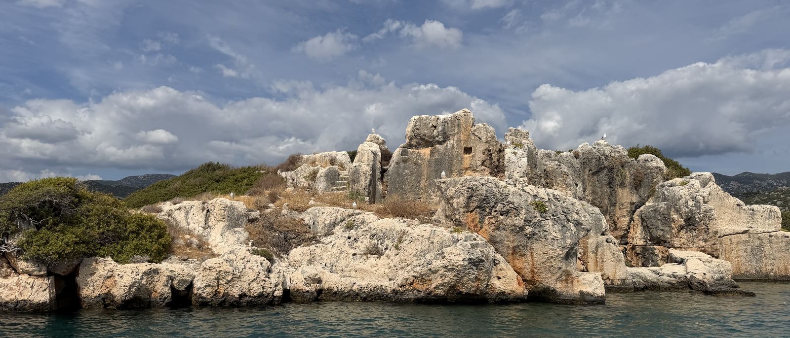 The rocky shoreline of the Kekova strait — the stretch of the Lycian Way crossed by sea