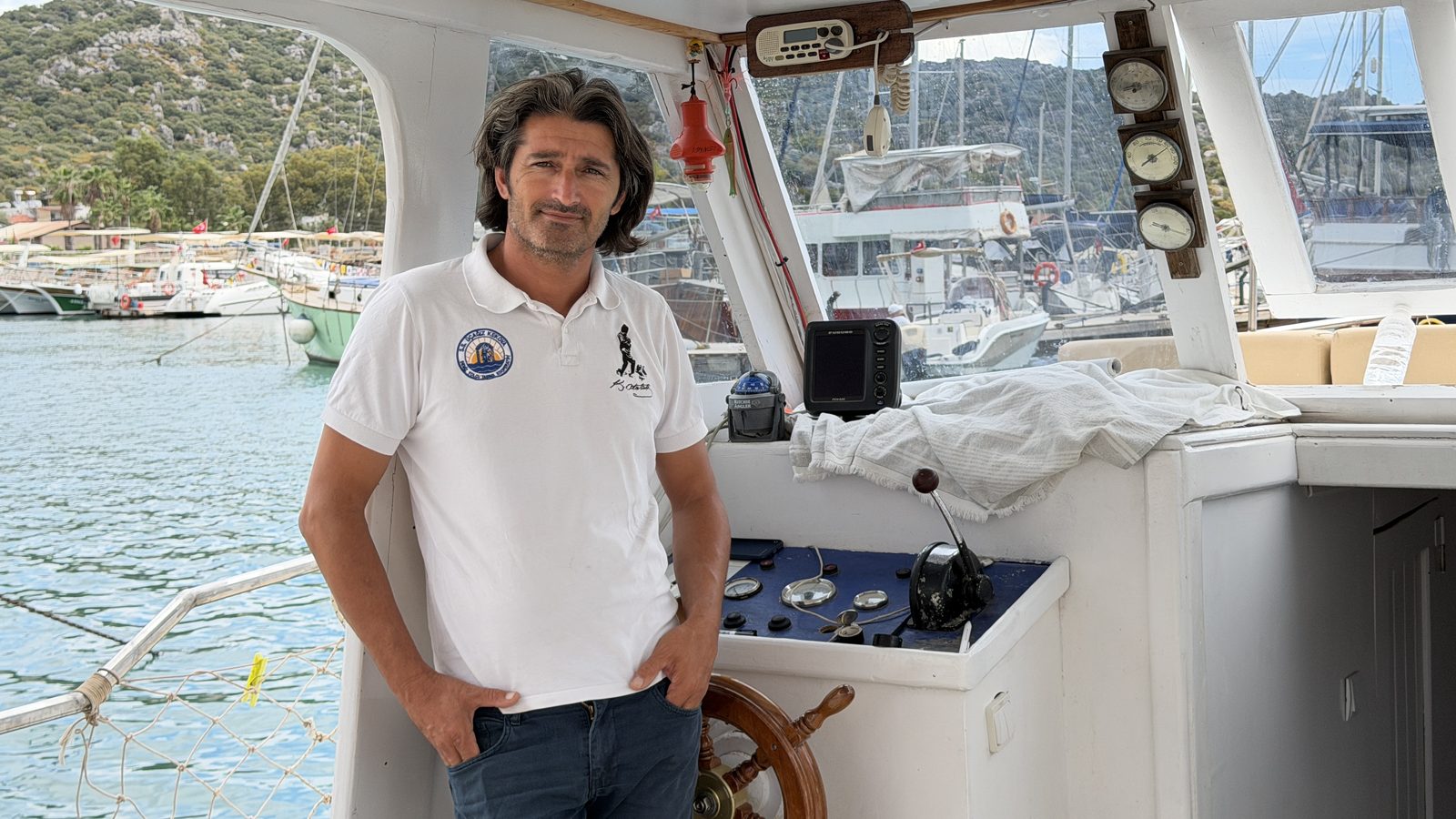 Captain Turgay Poyraz at the wheel of KemalEv2
